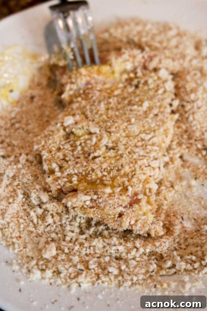 chicken covered in bread crumbs