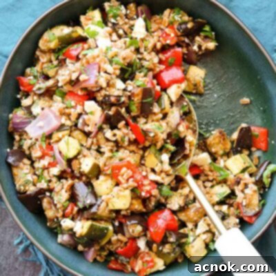 square size balsamic roasted vegetable grain salad with serving spoon