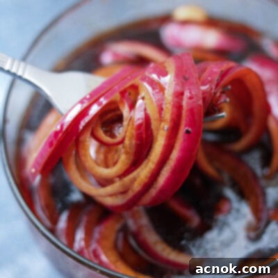Close-up of perfectly marinated balsamic red onions, ready to be served as a delicious topping.
