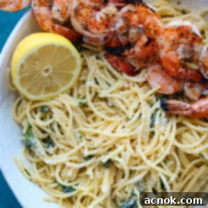 square photo of roasted garlic spaghetti with grilled shrimp