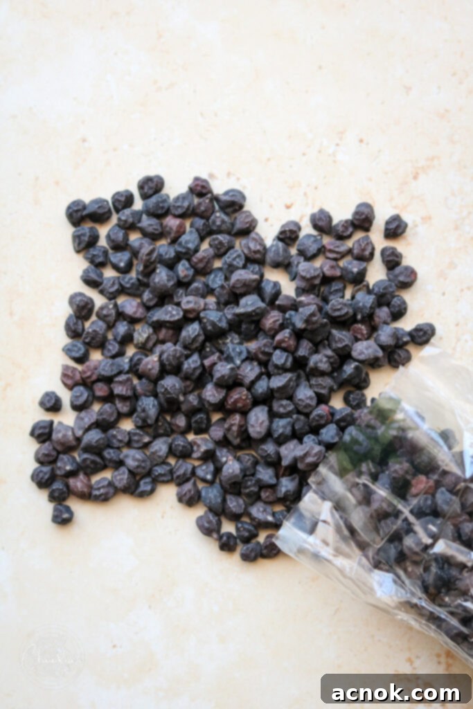 black garbanzo beans on beige background 
