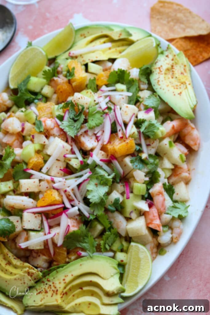 platter of zesty shrimp avocado jicama salad with tortilla chips 
