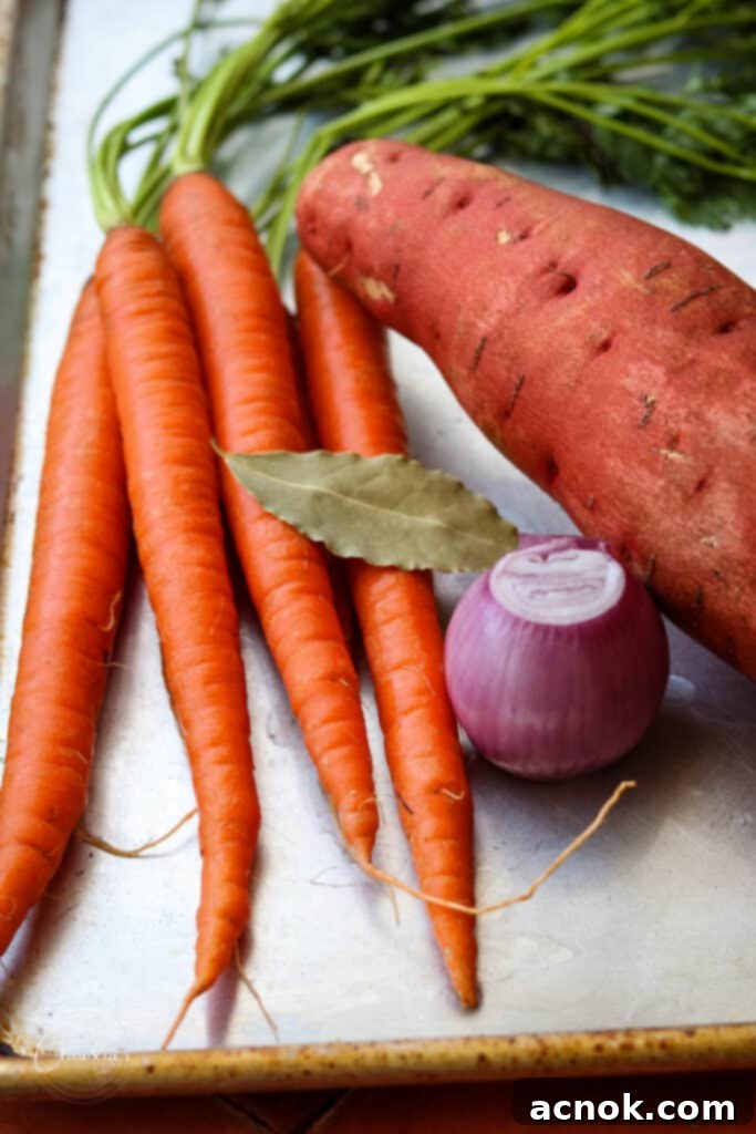 carrots, sweet potato and shallot on tray