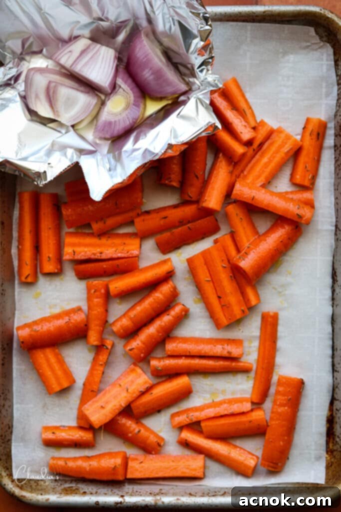 carrots and shallots on sheet pan