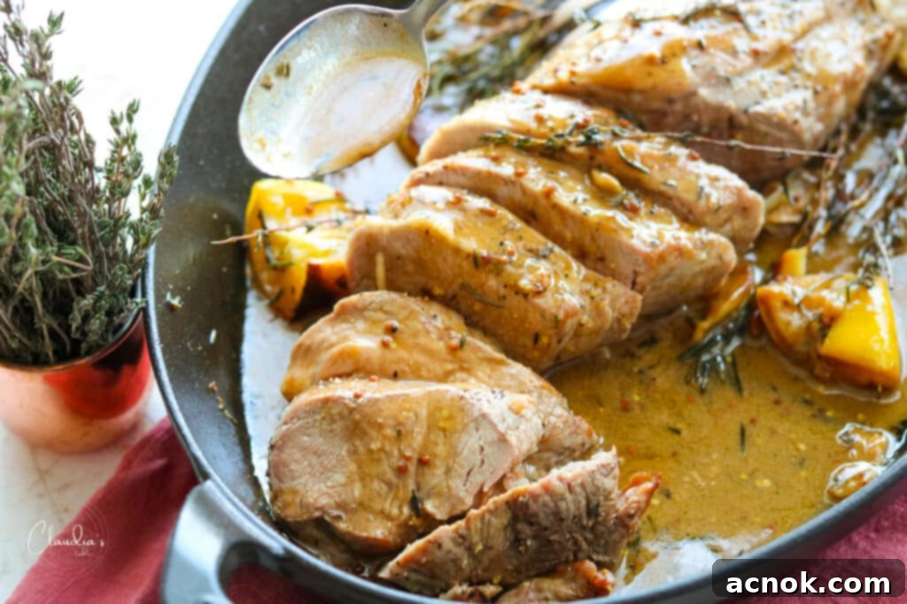 Sliced pork tenderloin with lemon herb pan sauce beautifully plated