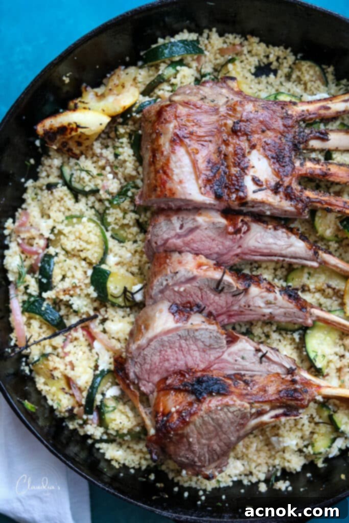 rosemary lemon rack of lamb with zucchini feta couscous in cast iron pan 