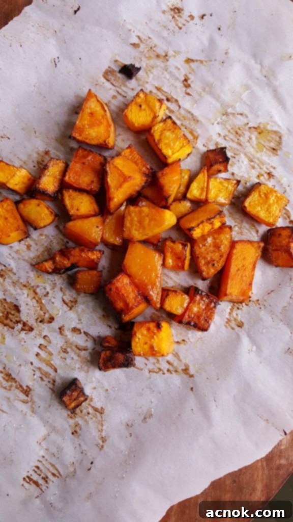 roasted butternut squash on rimmed baking sheet