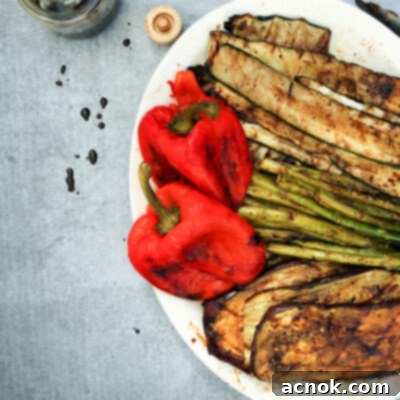 Grilled balsamic vegetables served on a white platter