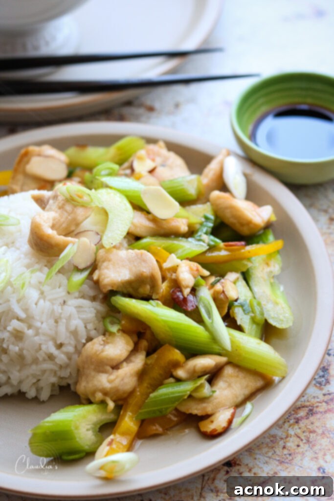 Close-up of a vibrant and delicious easy almond chicken stir-fry served in a bowl, ready to eat.