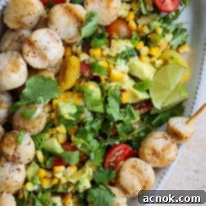 square image of spicy grilled scallops with corn, avocado, tomatoes