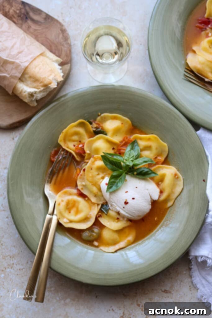 Italian Ravioli with burst tomatoes with bread and wine