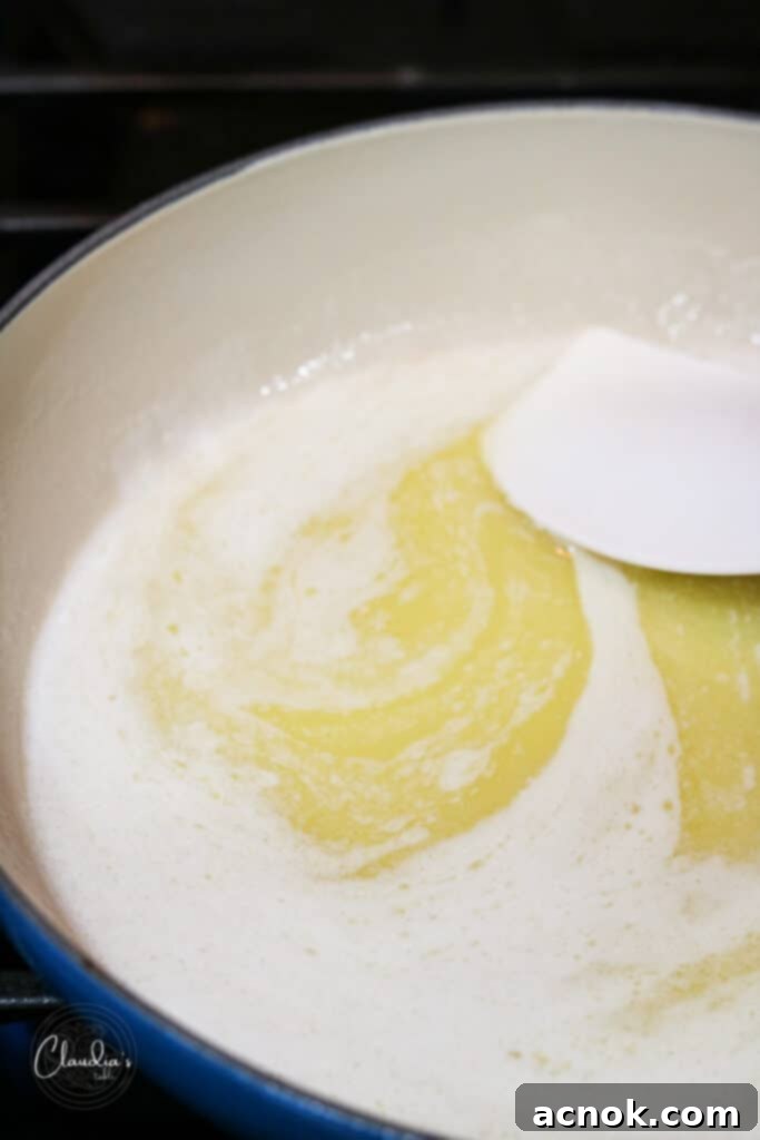 Butter slightly foaming with a nutty aroma beginning to emerge from the caramelizing milk solids.