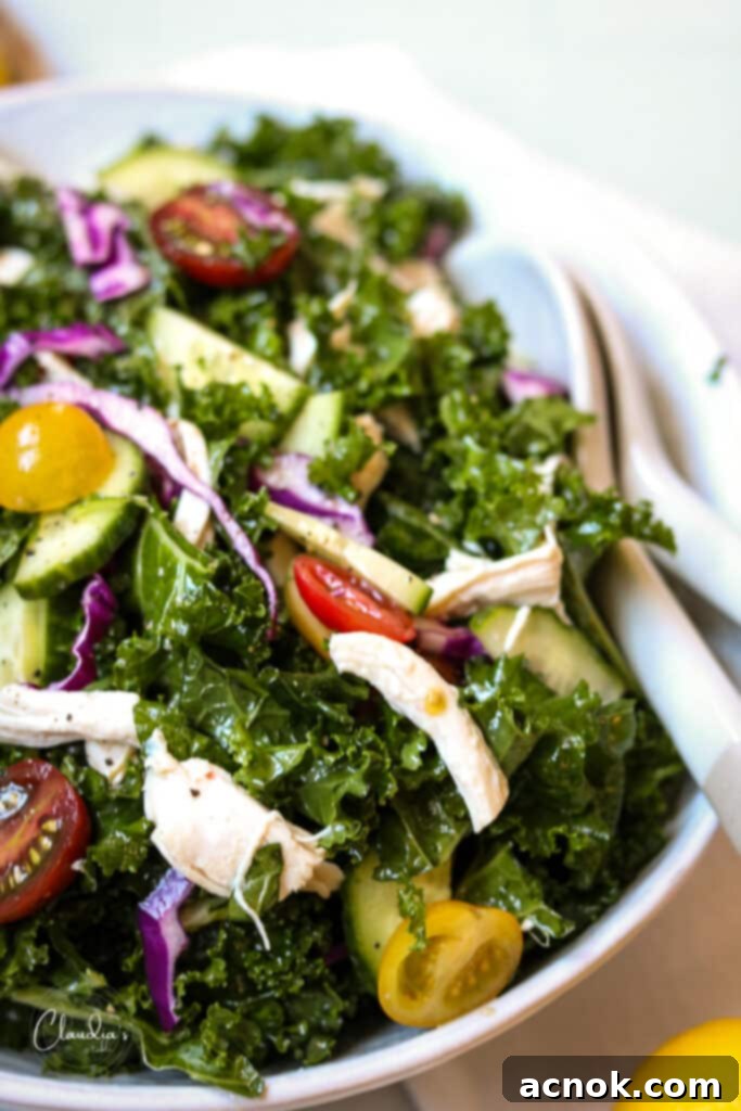 Close up view of a delicious Mediterranean kale salad, highlighting the texture and vibrant colors of the ingredients.
