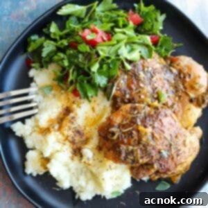 close up chicken thighs and feta mashed potatoes with parsley salad