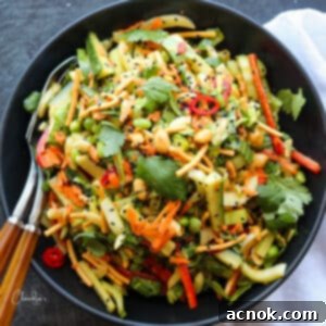 close up of Crunchy Bok Choy Salad with Spicy Peanut Dressing in a bowl