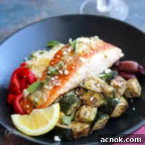 salmon with lemon garlic sauce, zucchini, couscous, red peppers and olives