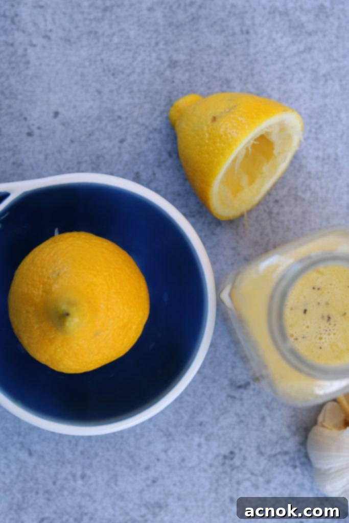 A vibrant cluster of fresh, ripe lemons on a wooden surface, ready to be juiced for a delicious dressing.