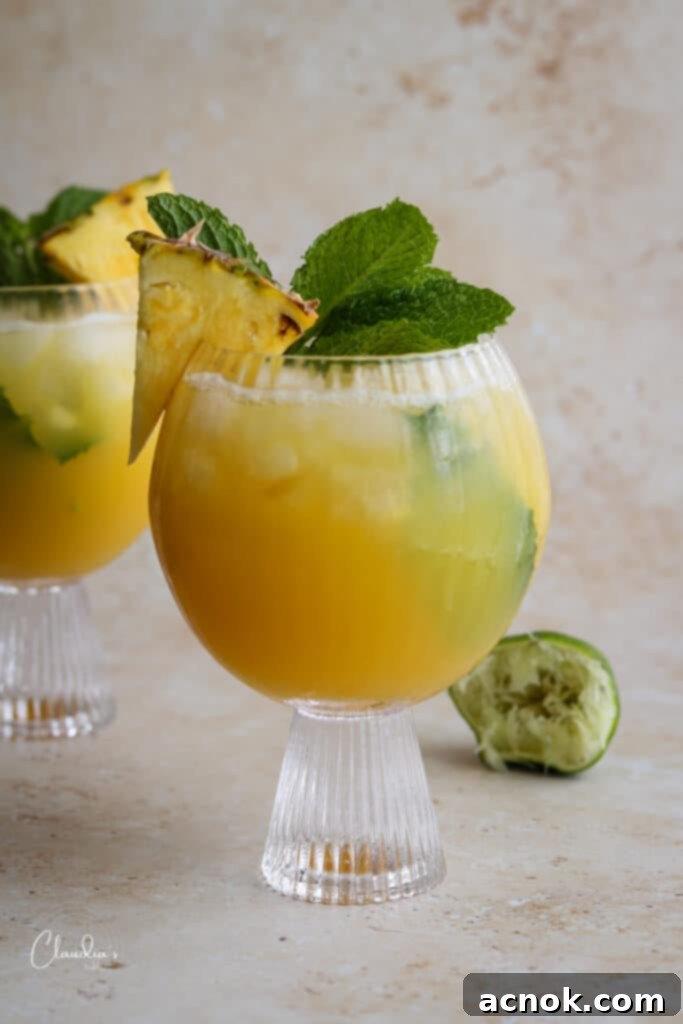 healthy tropical mocktail with fresh mint and pineapple