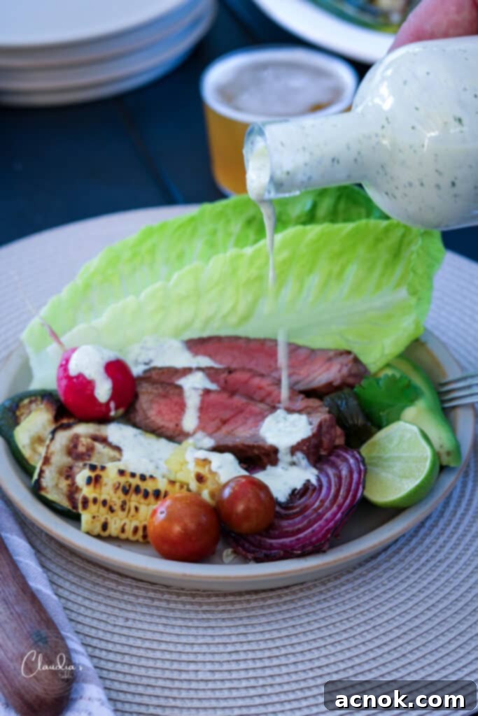 plate with grilled steak, romaine and vegetables