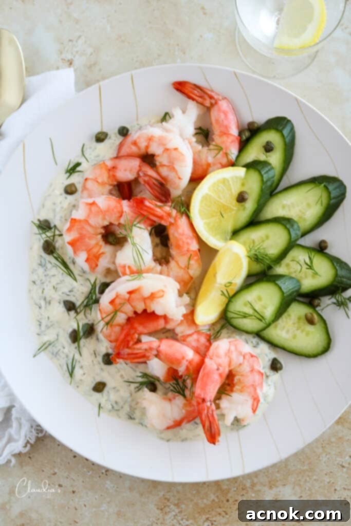 chilled shrimp appetizer platter with shrimp, cucumber, capers, lemon wedges