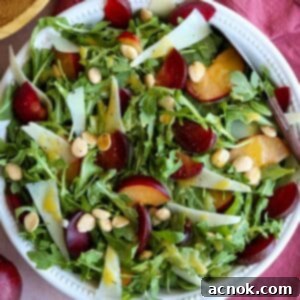 square image of plum salad with manchego and marcona almonds