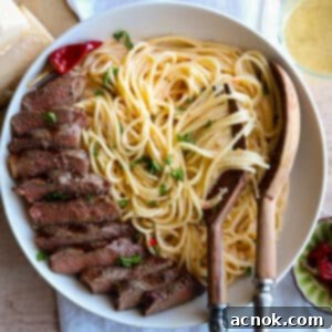 square image of creamy calabrian chili pasta with NY strip steak