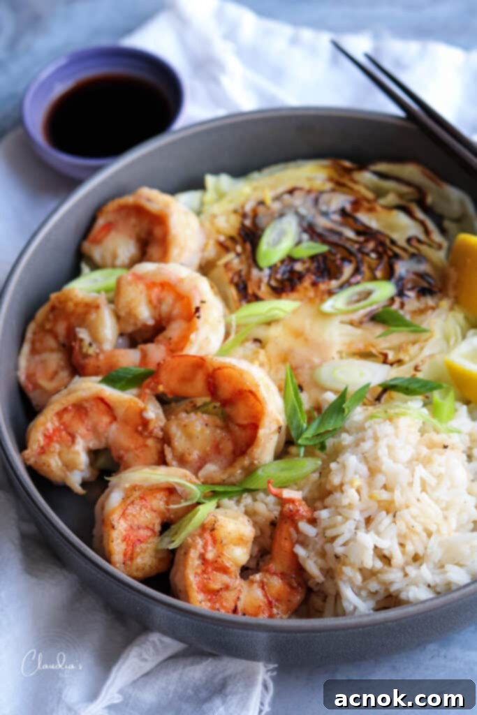 Miso butter shrimp with charred cabbage and steamed rice, showcasing a perfectly plated meal.