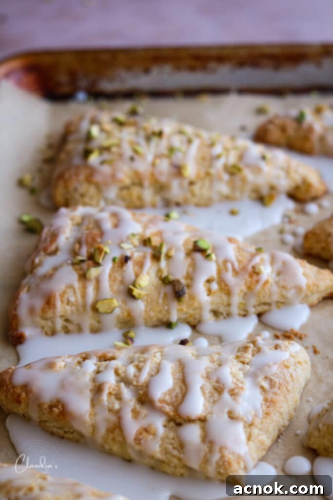Adding pistachios to glazed scones