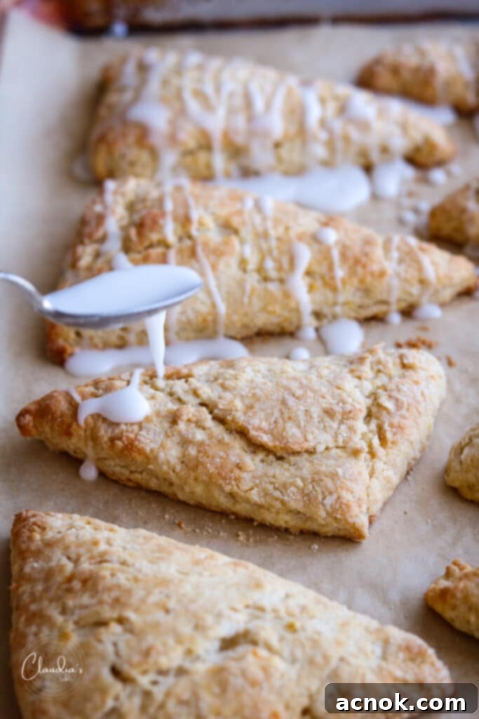 Drizzling rosewater glaze on scones