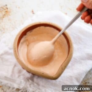 Chipotle Crema drizzled over tacos, highlighting its creamy texture and rich color.