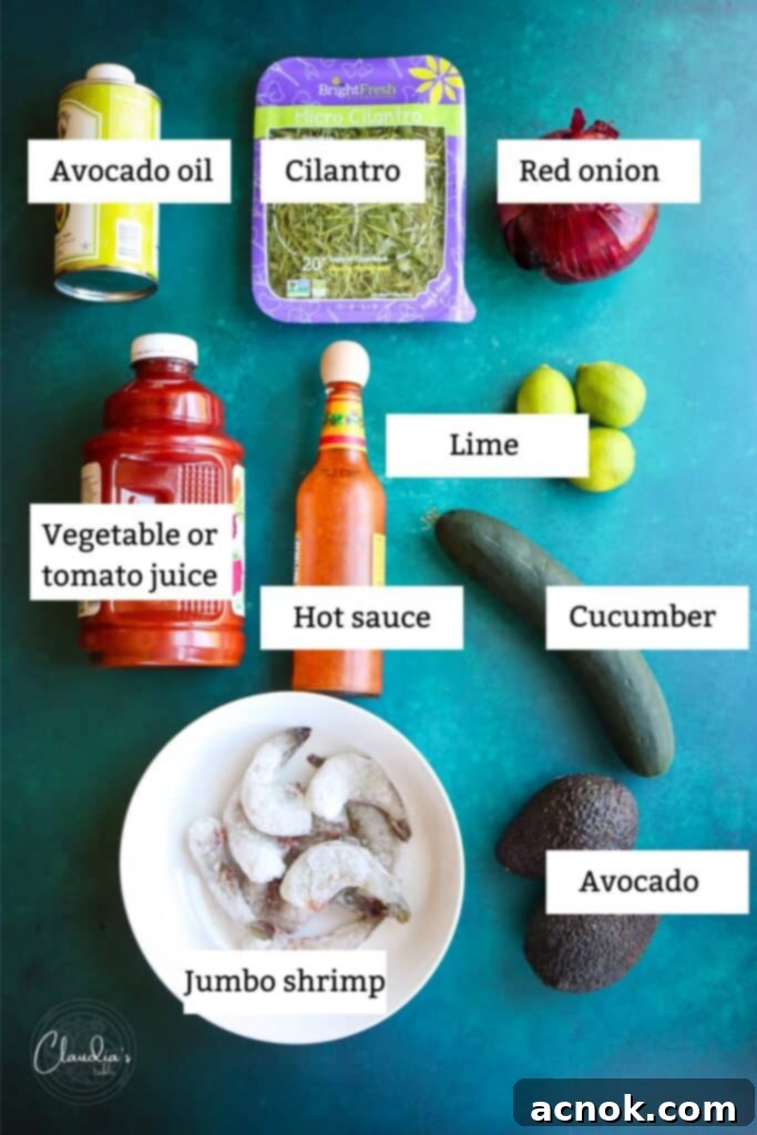 Main ingredients for Easy Shrimp Avocado Salad Boats, including shrimp, avocados, tomatoes, cucumber, onion, cilantro, and spices.