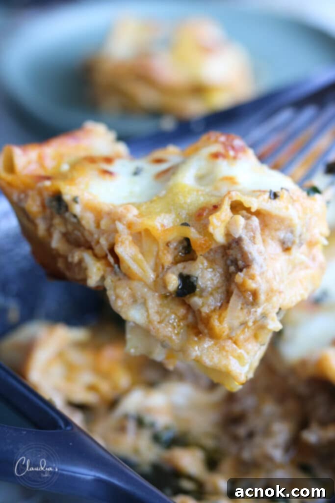 Savory Autumn Lasagna: Pumpkin, Sausage & Kale Delight 6 Close up of pumpkin lasagna sliced.